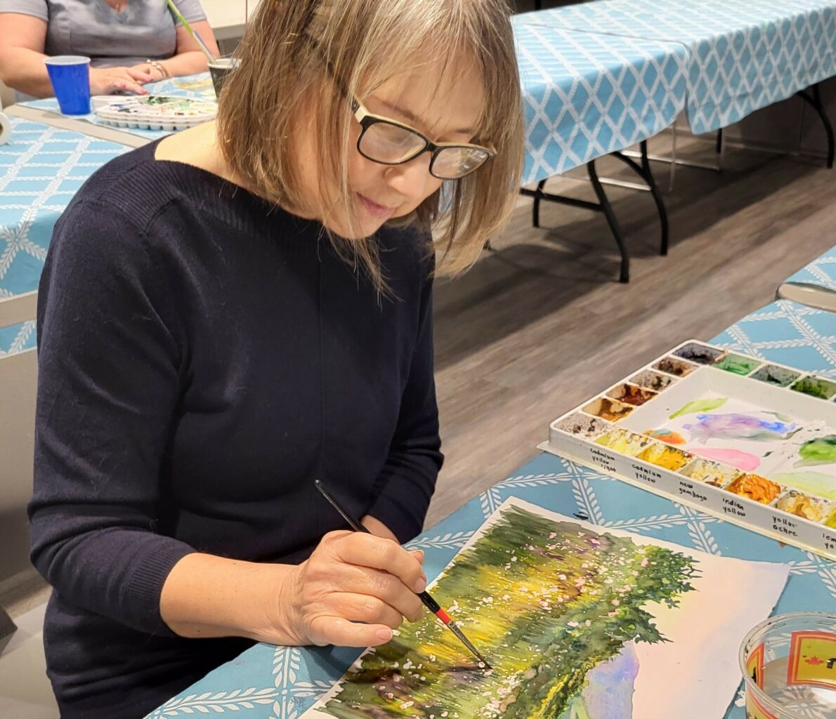 woman painting in watercolour