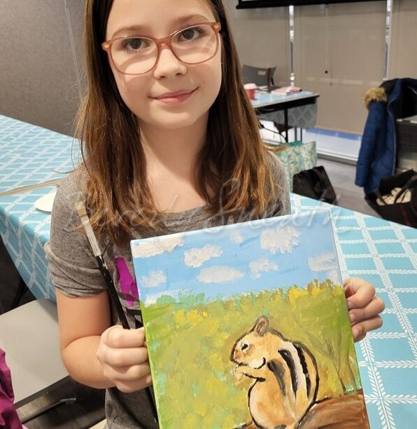 girl with painting of a chipmunk