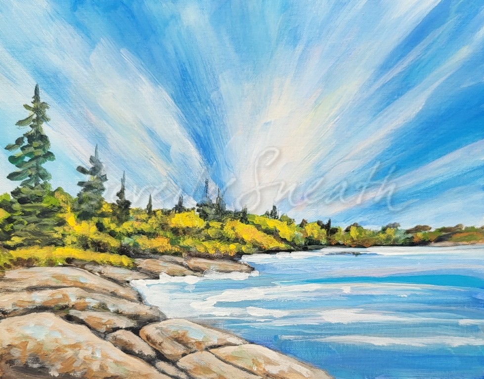 Blue sky, dramatic cloud pattern, lake, rocks and trees