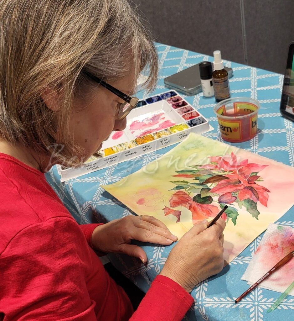 woman painting with watercolours
