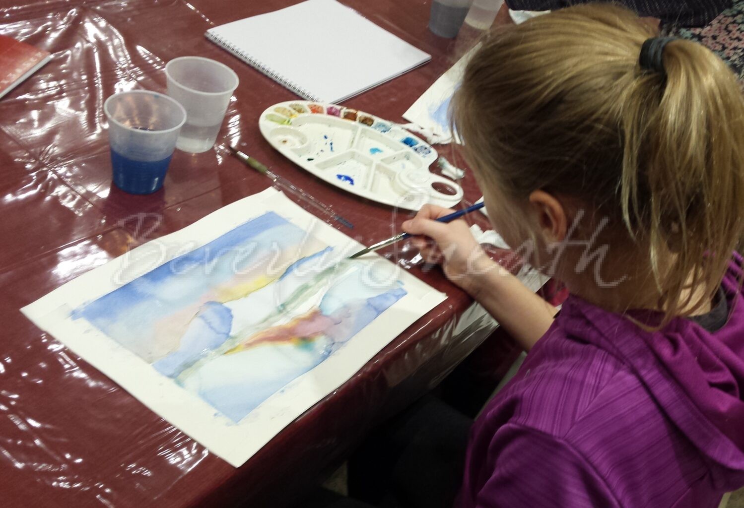 girl painting with watercolour