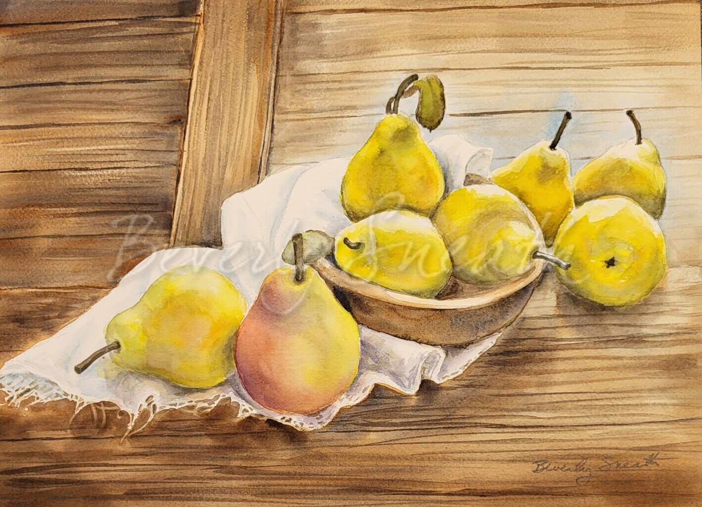 Pears in bowl and on cloth on board surface.